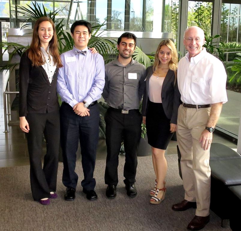 Students Katarina Schmidt, Kevin Wong, and Selina Schweitzer with client Edris Bemanian (third from left) and project mentor Terry Nathan (on the right) at the Third-Year Convocation.  