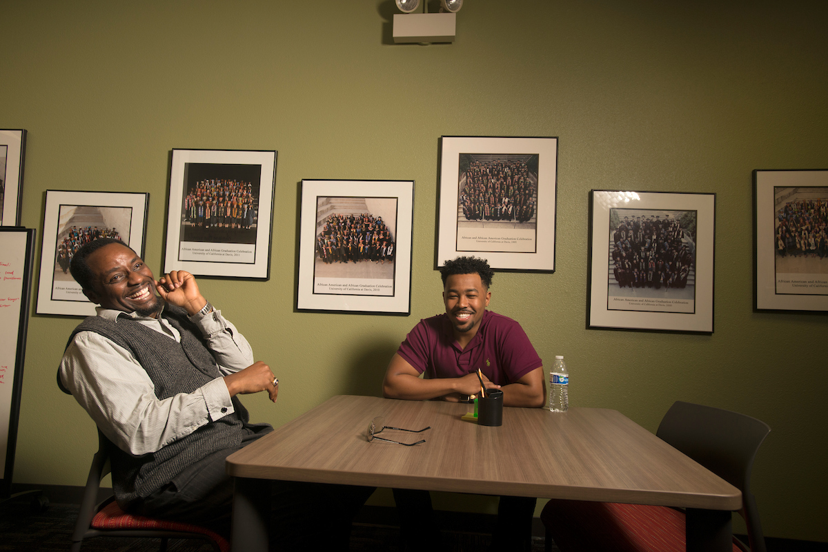 Kayton Carter laughs while advising a student