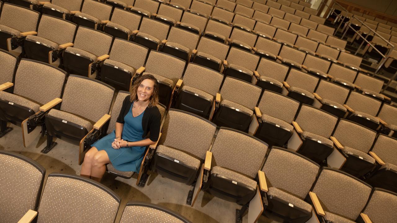 Laci Gerhart sitting in empty classroom