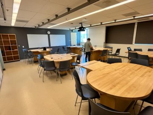 Lecturer prepares audio equpment in newly updated lab and discussion rooms.